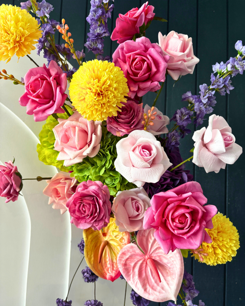 pink yellow and green floral arrangements with purple